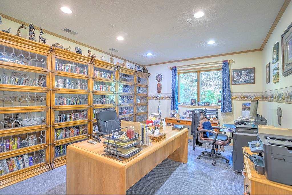 853 Spring Ridge Court Belvidere, IL 61008 - Photo 36 of 46 a room with furniture and a bookshelf