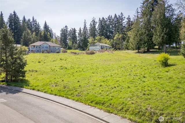 a view of a garden with an outdoor seating