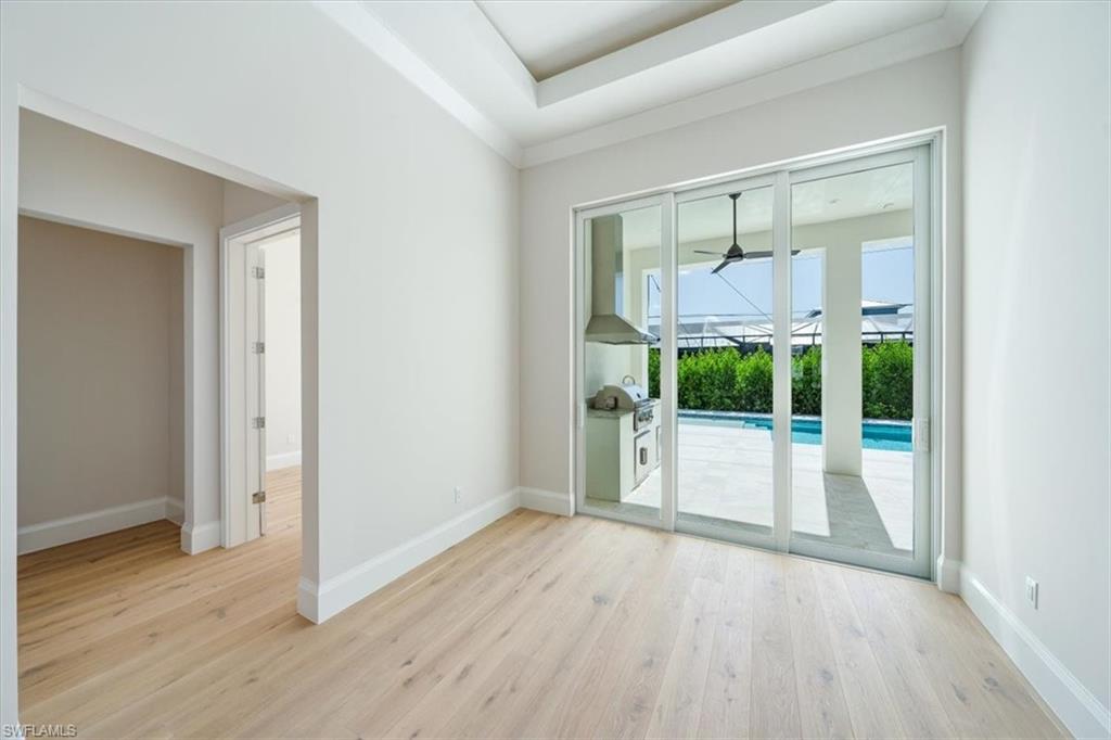 23511 Coconut Road Estero, FL 34134 - Photo 12 of 50 a view of a room with wooden floor and garden view