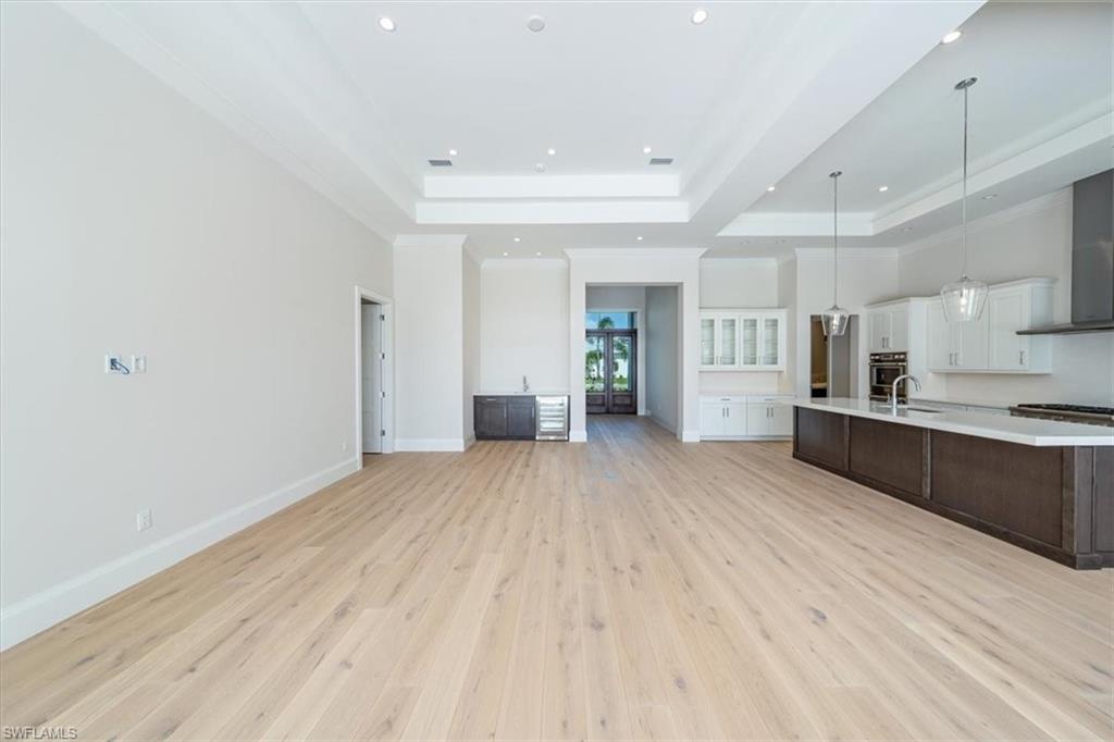 23511 Coconut Road Estero, FL 34134 - Photo 14 of 50 a view of kitchen with wooden floor