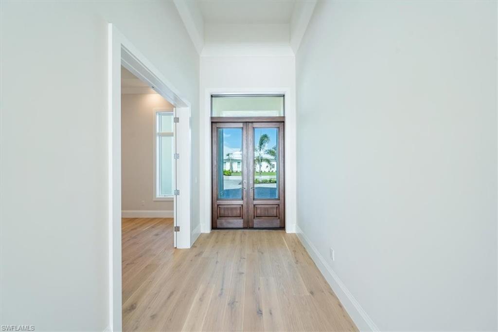 23511 Coconut Road Estero, FL 34134 - Photo 16 of 50 a view of wooden floor in a room