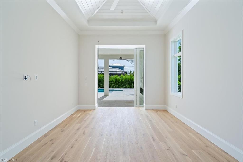 23511 Coconut Road Estero, FL 34134 - Photo 18 of 50 wooden floor in an empty room with a window