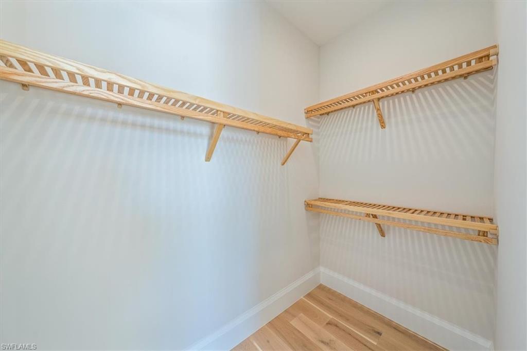 23511 Coconut Road Estero, FL 34134 - Photo 31 of 50 a view of a room with racks on the wall