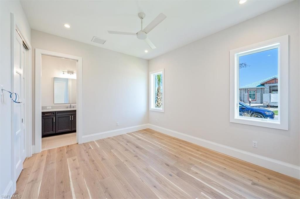 23511 Coconut Road Estero, FL 34134 - Photo 34 of 50 wooden floor in an empty room with a window