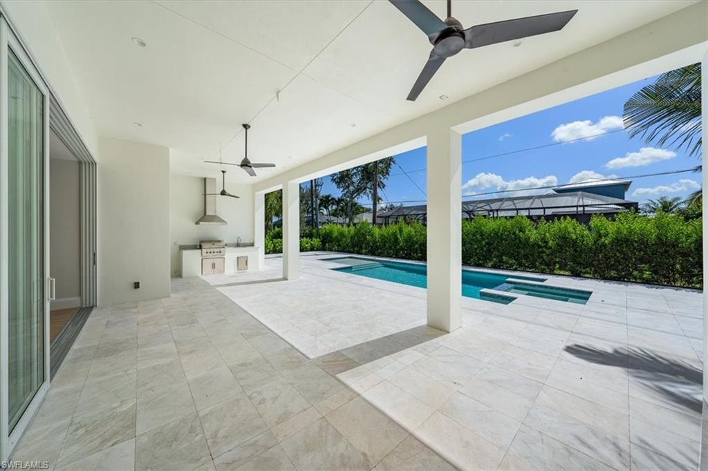 23511 Coconut Road Estero, FL 34134 - Photo 39 of 50 a view of a porch with furniture and a yard