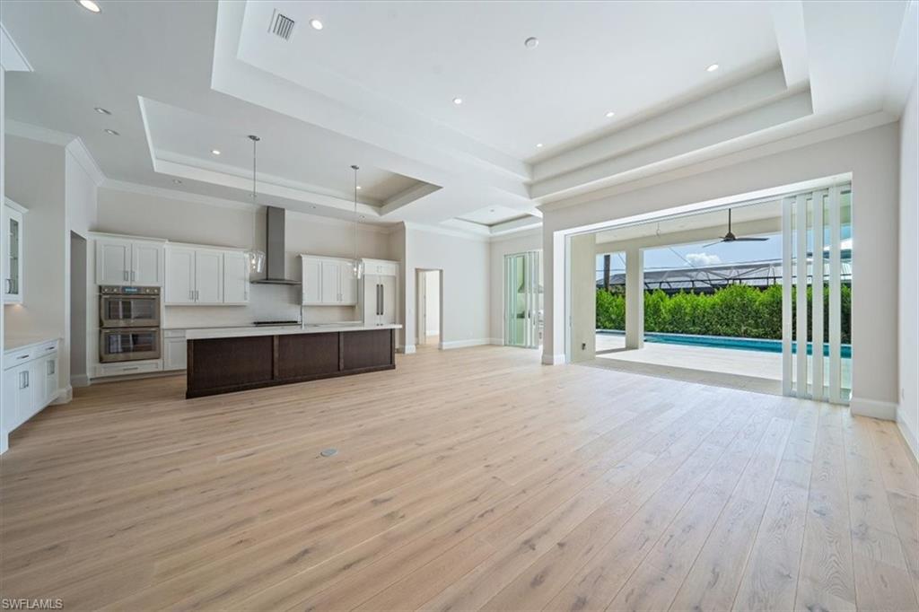 23511 Coconut Road Estero, FL 34134 - Photo 4 of 50 a view of a kitchen with a sink and a large window