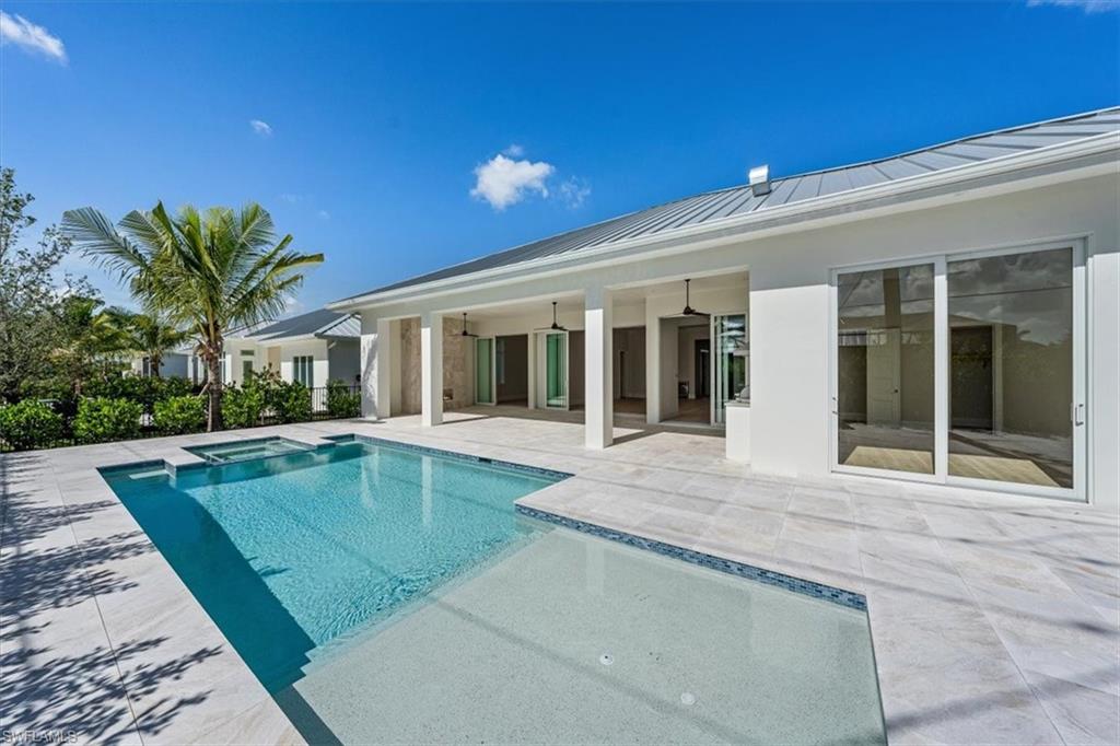 23511 Coconut Road Estero, FL 34134 - Photo 42 of 50 front view of a house with a swimming pool