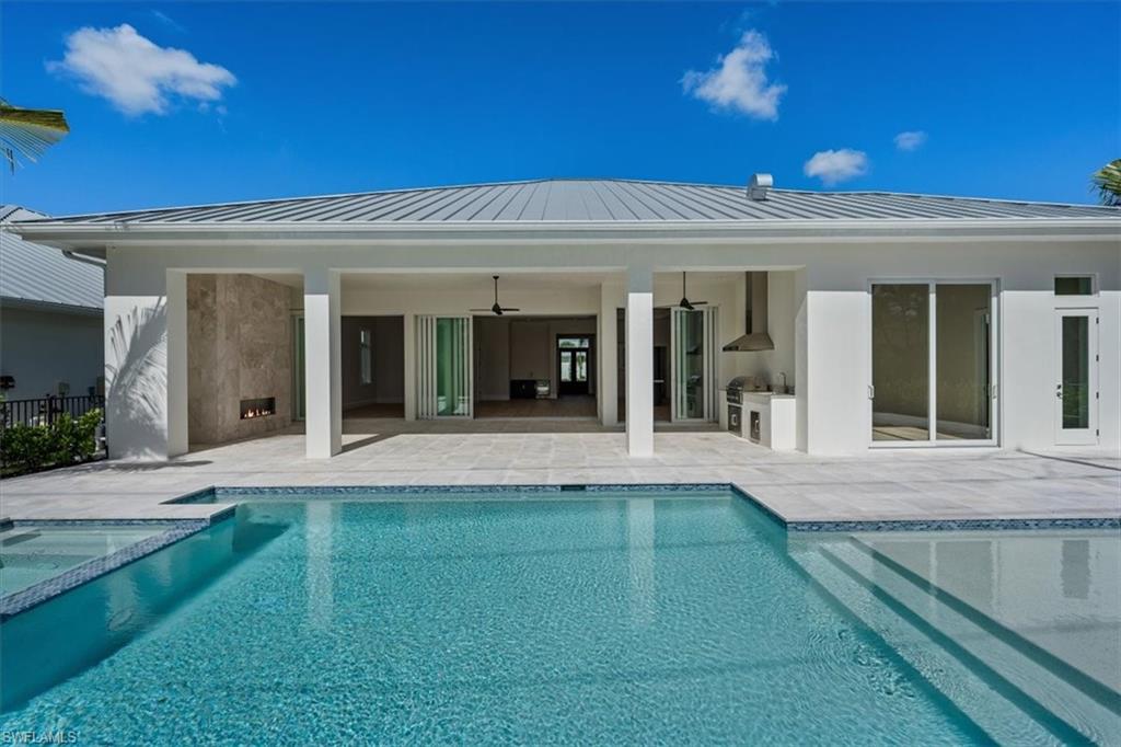 23511 Coconut Road Estero, FL 34134 - Photo 43 of 50 a view of a house with a porch