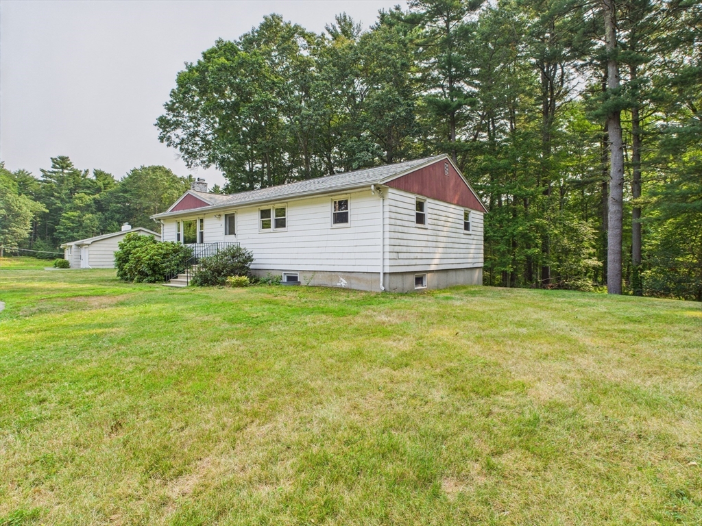 91 Old Post Road Sharon, MA 02067 - Photo 16 of 18 a front view of house with yard and green space