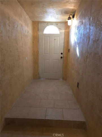 a view of entryway with a front door