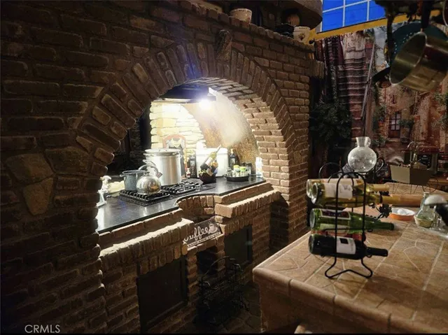 a room with lots of furniture and a chandelier