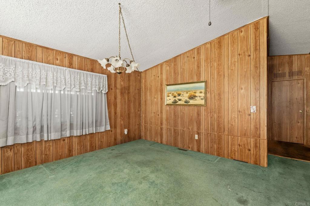 11949 Riverside Drive, Unit 23 Lakeside, CA 92040 - Photo 11 of 35 an empty room with windows and stairs