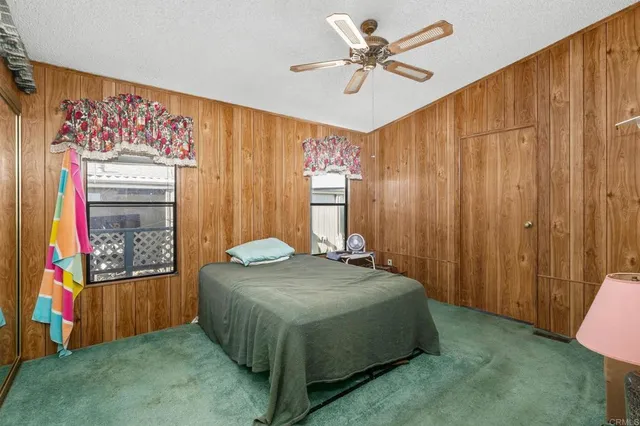 a bedroom with a bed and a table