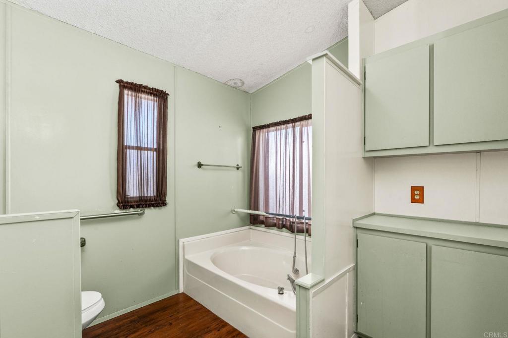 11949 Riverside Drive, Unit 23 Lakeside, CA 92040 - Photo 20 of 35 a bathroom with a sink and a bathtub