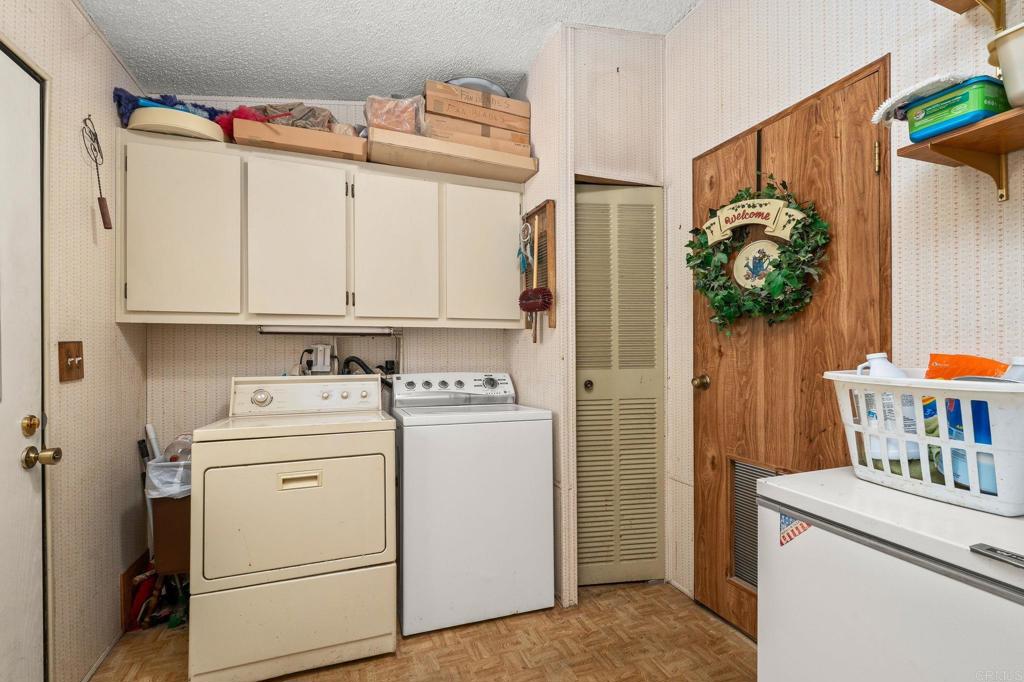 11949 Riverside Drive, Unit 23 Lakeside, CA 92040 - Photo 25 of 35 a utility room with dryer and washer