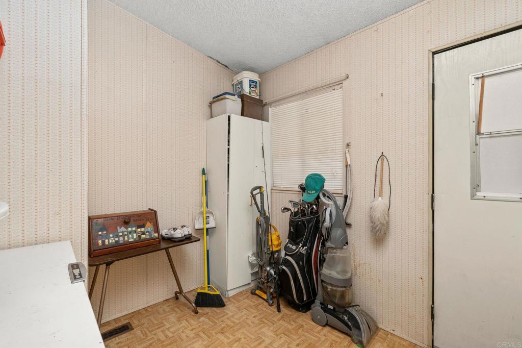 11949 Riverside Drive, Unit 23 Lakeside, CA 92040 - Photo 26 of 35 a view of a workspace with furniture and a gate