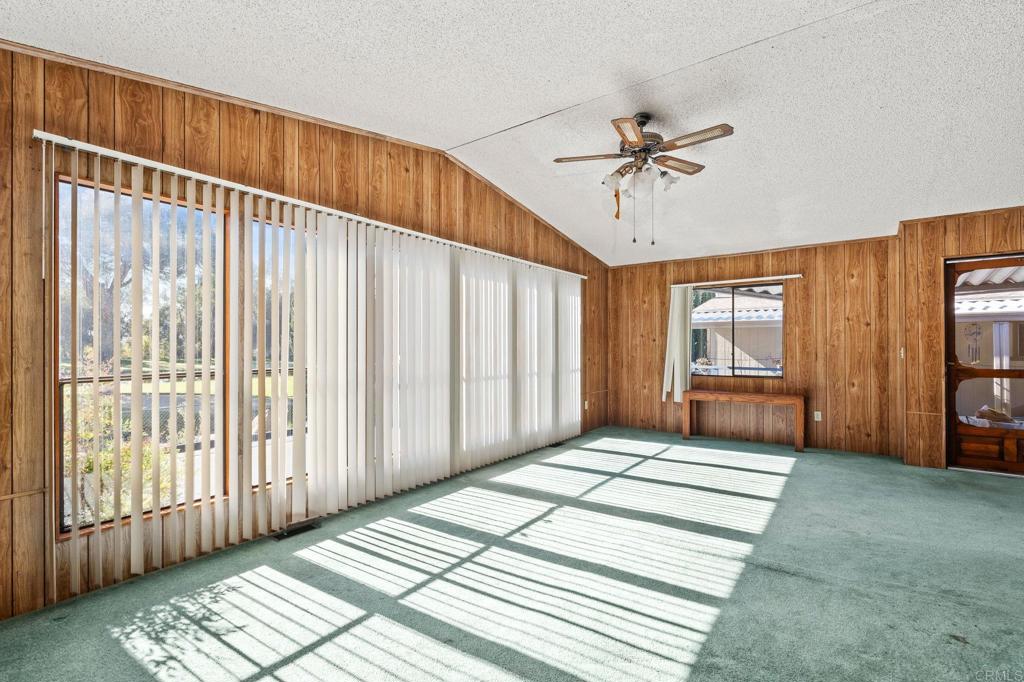 11949 Riverside Drive, Unit 23 Lakeside, CA 92040 - Photo 6 of 35 a view of a bedroom with wooden floor and windows