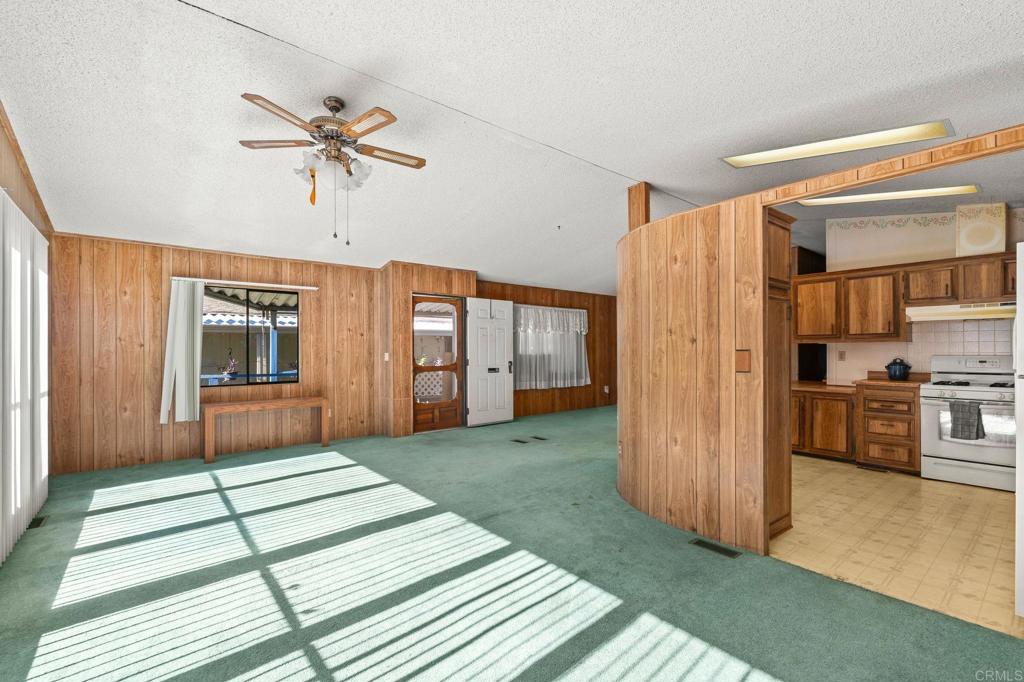 11949 Riverside Drive, Unit 23 Lakeside, CA 92040 - Photo 8 of 35 a view of livingroom with hardwood floor and kitchen