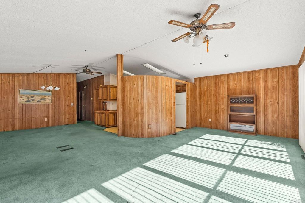 11949 Riverside Drive, Unit 23 Lakeside, CA 92040 - Photo 9 of 35 a view of a livingroom with a hall and a ceiling fan