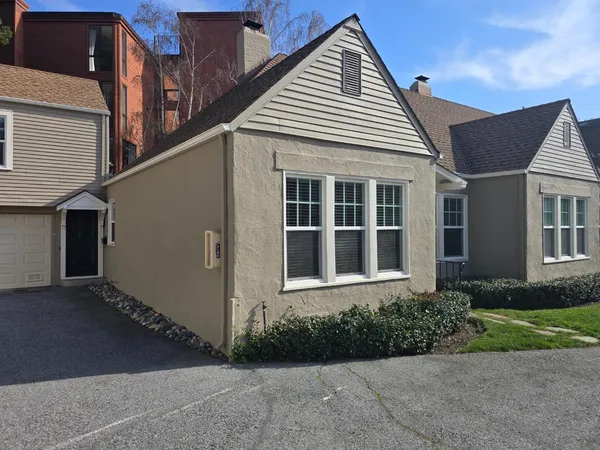 a front view of a house with garden
