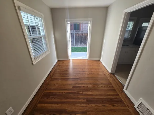 a view of an entryway with wooden floor and stairs