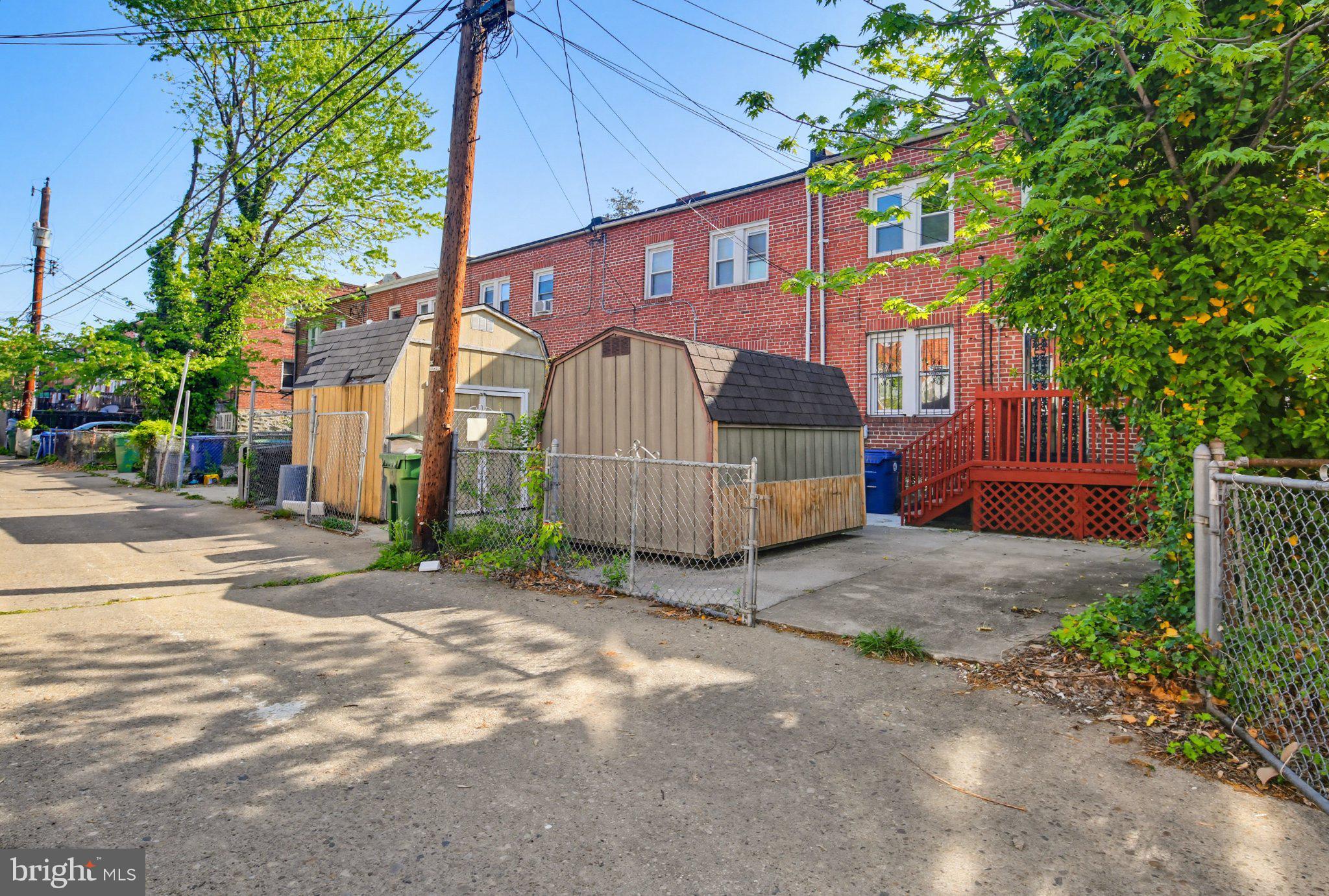 12 North Rosedale Street Baltimore, MD 21229 - Photo 15 of 25 Charming alleyway with cozy sheds.