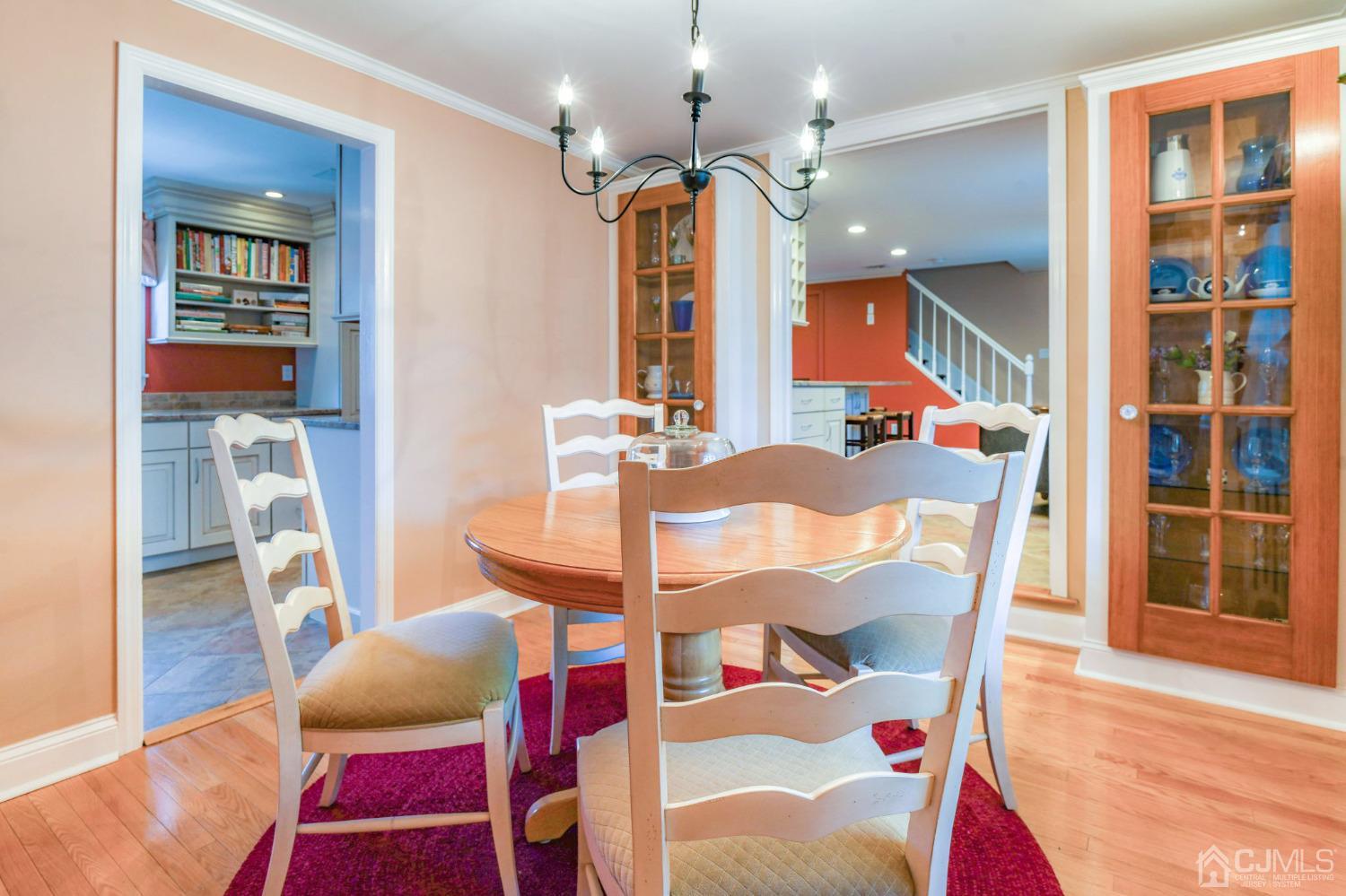 77 1st Street Edison, NJ 08837 - Photo 12 of 50 a view of a dining room with furniture and wooden floor