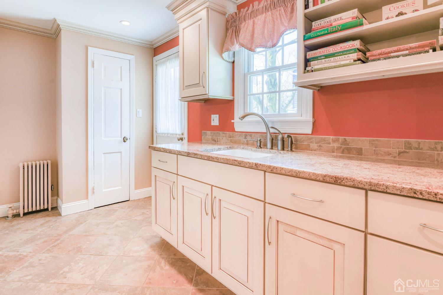 77 1st Street Edison, NJ 08837 - Photo 19 of 50 a bathroom with a granite countertop sink and a window