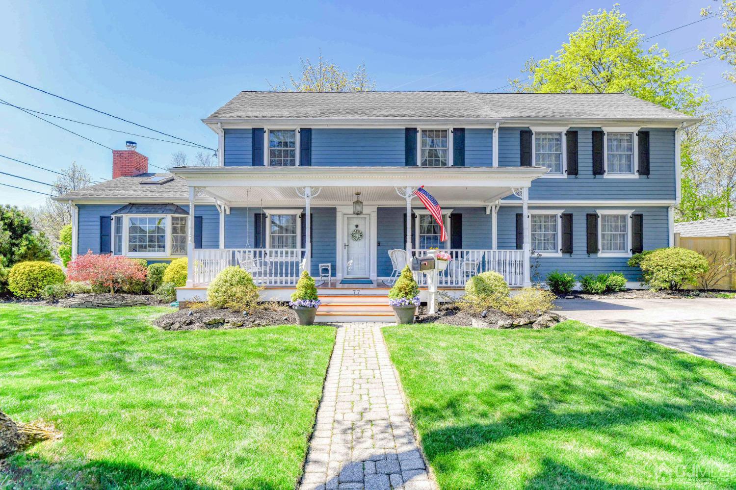 77 1st Street Edison, NJ 08837 - Photo 2 of 50 a front view of a house with garden and porch