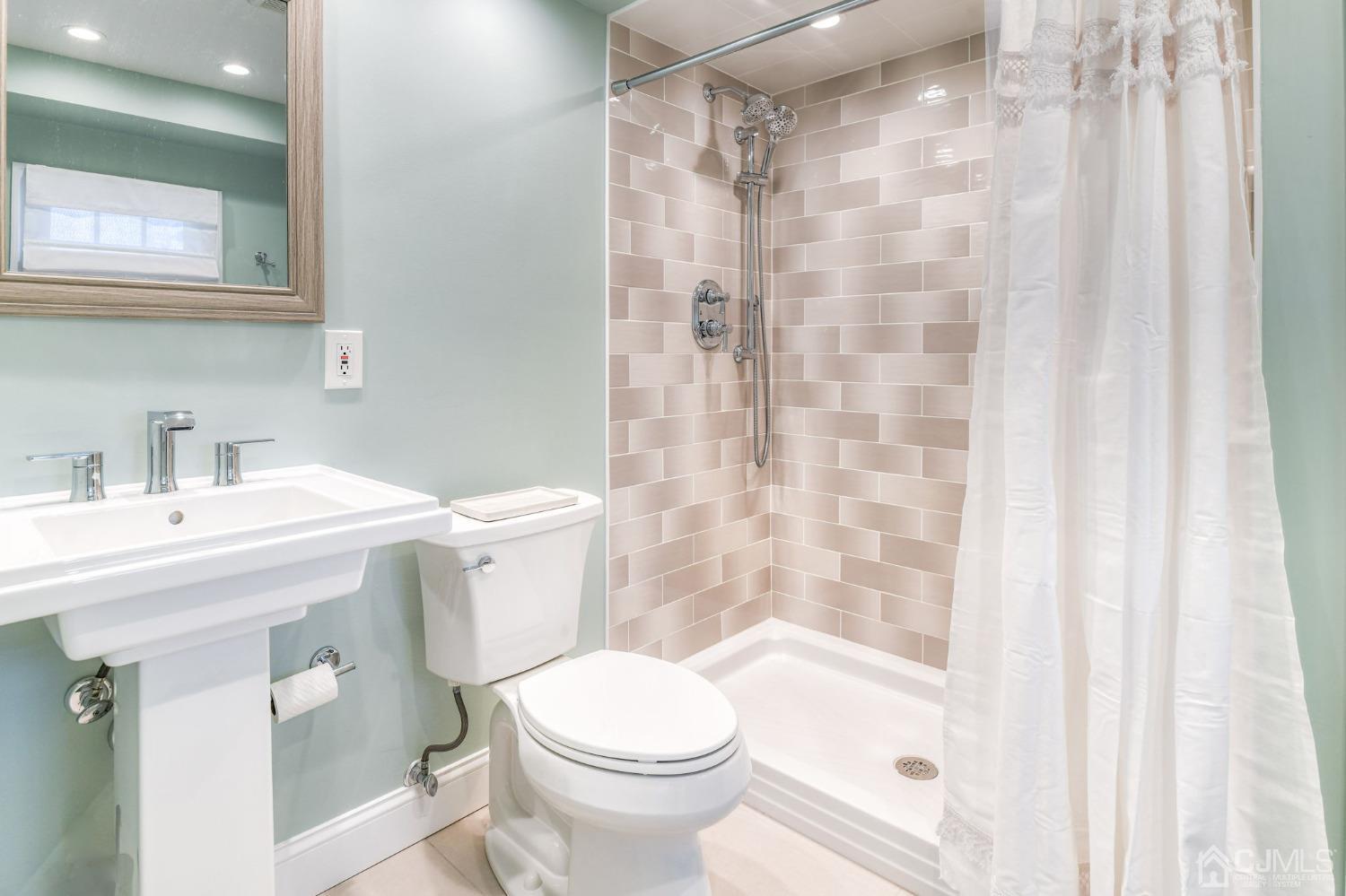 77 1st Street Edison, NJ 08837 - Photo 23 of 50 a bathroom with a sink toilet and shower