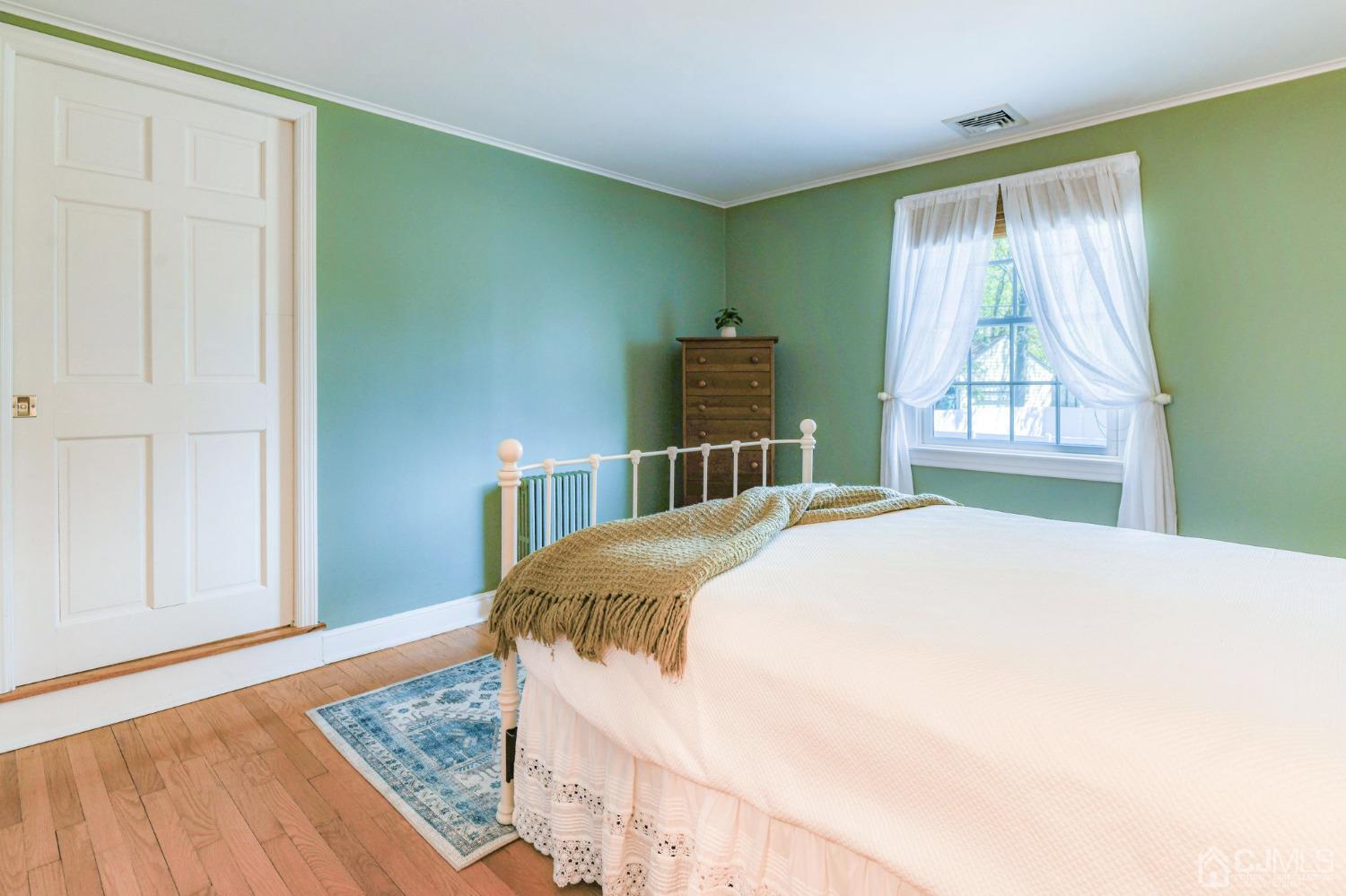 77 1st Street Edison, NJ 08837 - Photo 25 of 50 a bedroom with a bed and window