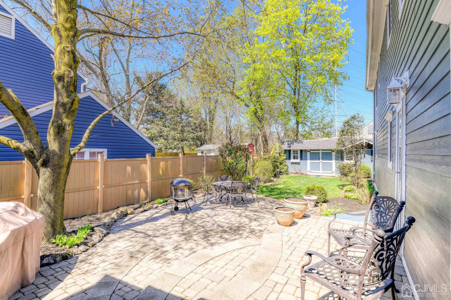 77 1st Street Edison, NJ 08837 - Photo 38 of 50 a backyard of a house with table and chairs