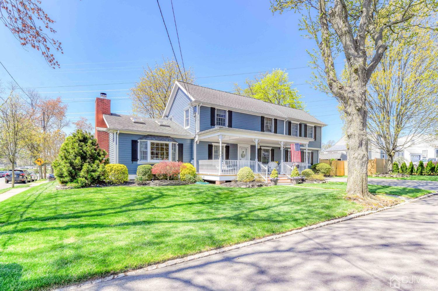 77 1st Street Edison, NJ 08837 - Photo 45 of 50 a front view of house with yard and green space