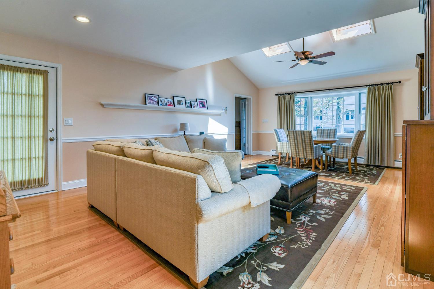77 1st Street Edison, NJ 08837 - Photo 8 of 50 a living room with furniture and a large window