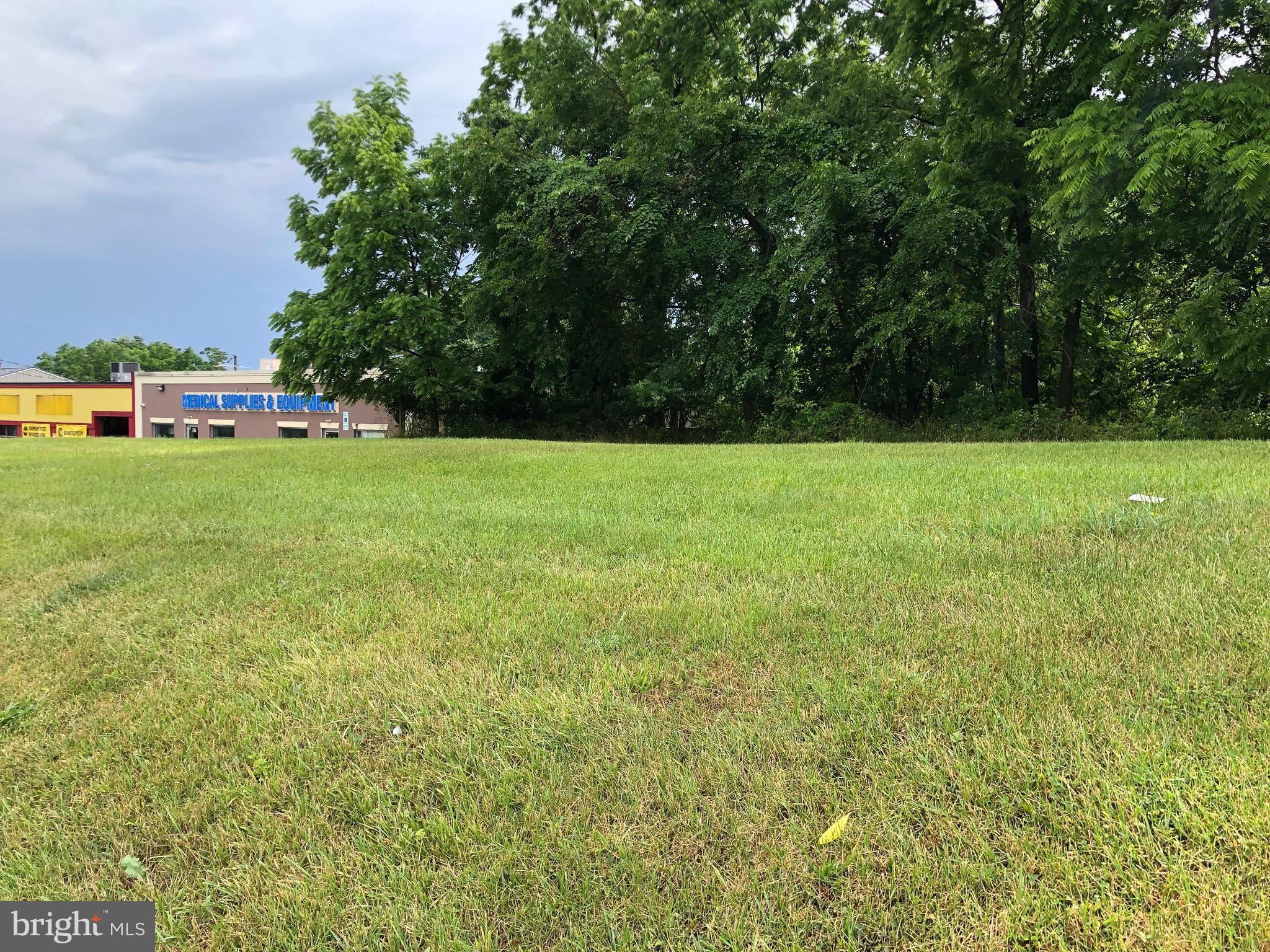 706-708 Main Street Reisterstown, MD 21136 - Photo 1 of 6 a view of a field of grass and trees