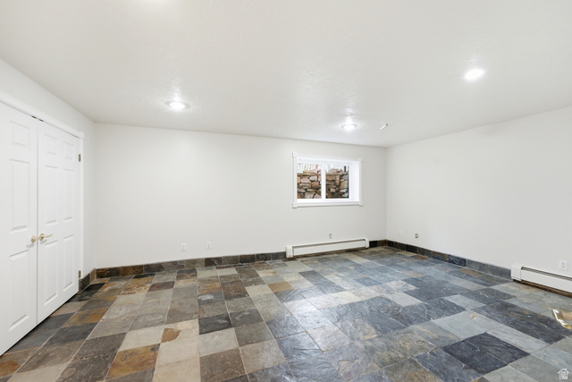 3535 Homestead Road Park City, UT 84098 - Photo 54 of 81 Spacious room featuring slate tile flooring, white walls, and a window with a stone well view
