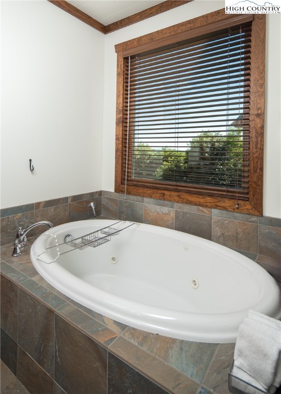 421 Chappell Farm Road Banner Elk, NC 28604 - Photo 21 of 49 a bath tub sitting in a bathroom next to a window