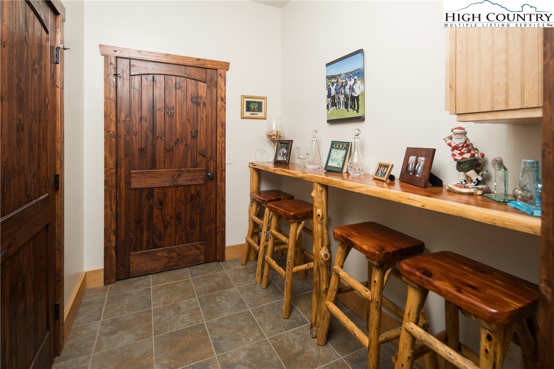 421 Chappell Farm Road Banner Elk, NC 28604 - Photo 35 of 49 a room with table chairs and a refrigerator