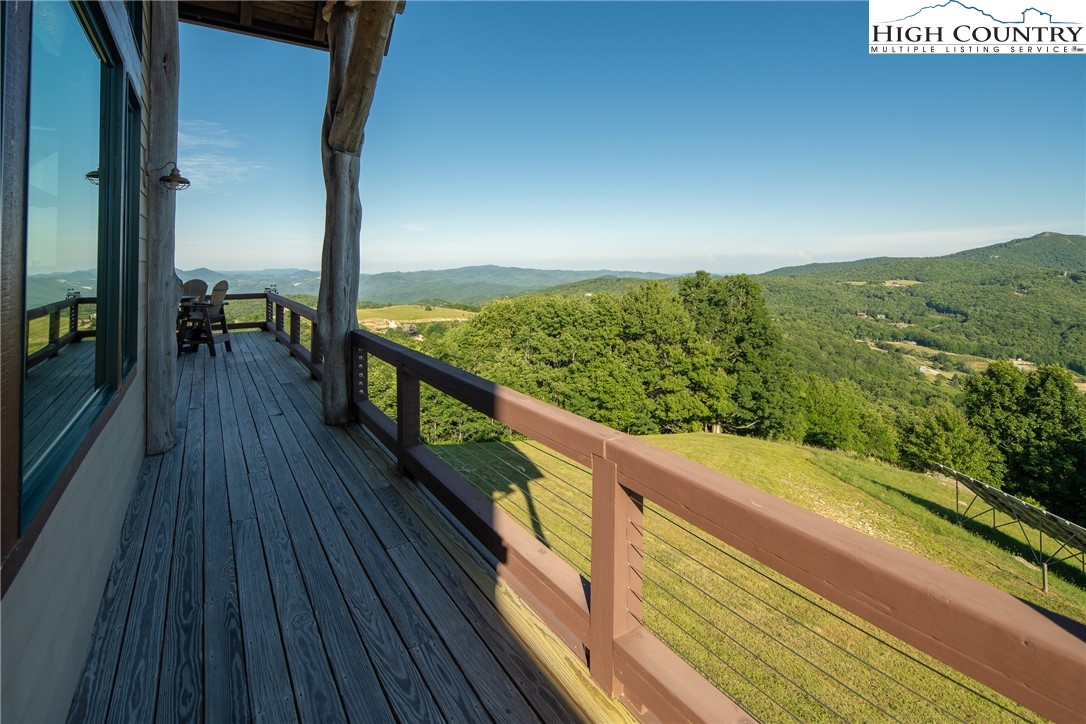 421 Chappell Farm Road Banner Elk, NC 28604 - Photo 42 of 49 a view of balcony with floor to ceiling windows with wooden floor