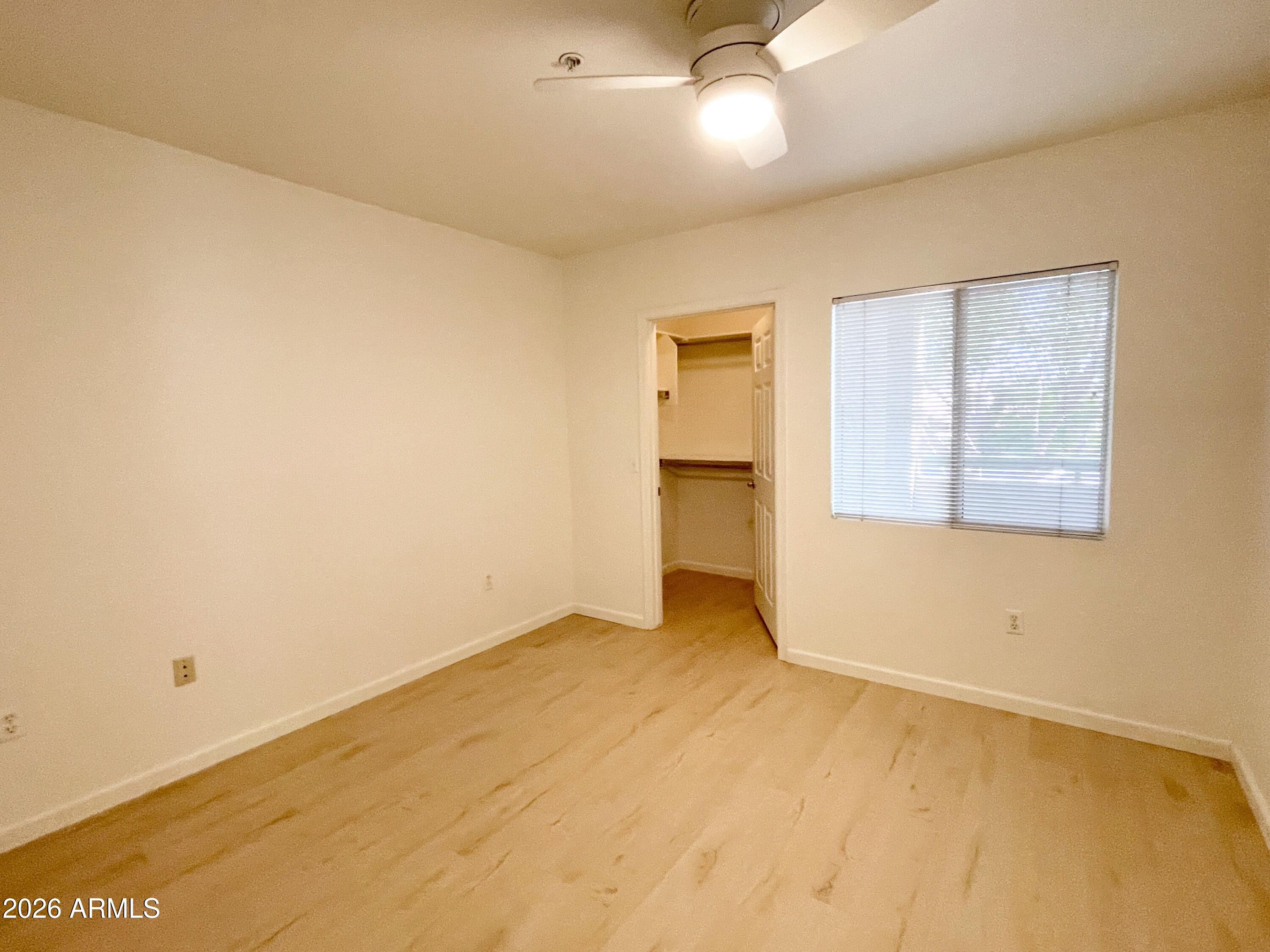 1295 North Ash Street, Unit 828 Gilbert, AZ 85233 - Photo 16 of 24 a view of an empty room with a window