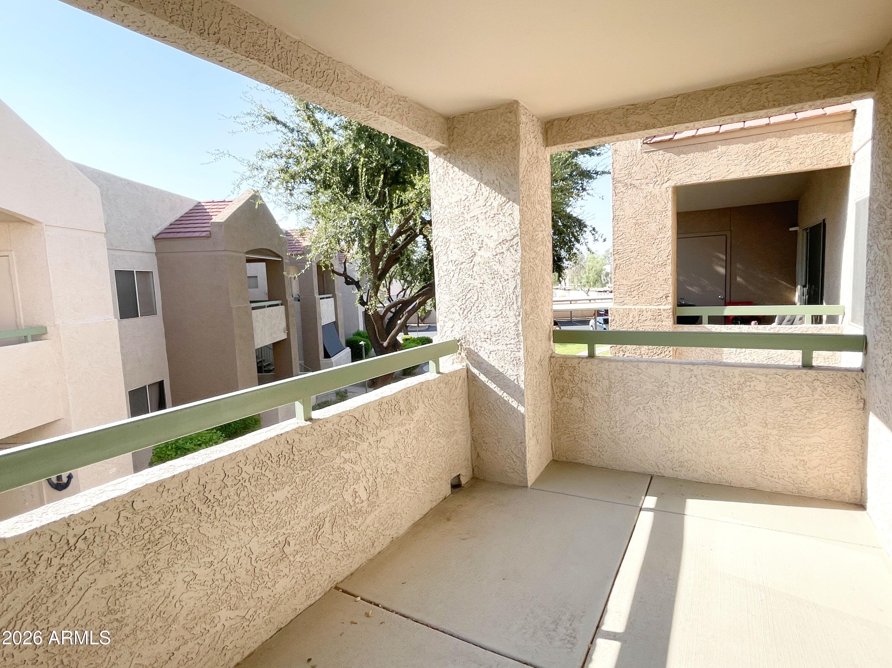 1295 North Ash Street, Unit 828 Gilbert, AZ 85233 - Photo 19 of 24 a view of living room kitchen with furniture and flat screen tv