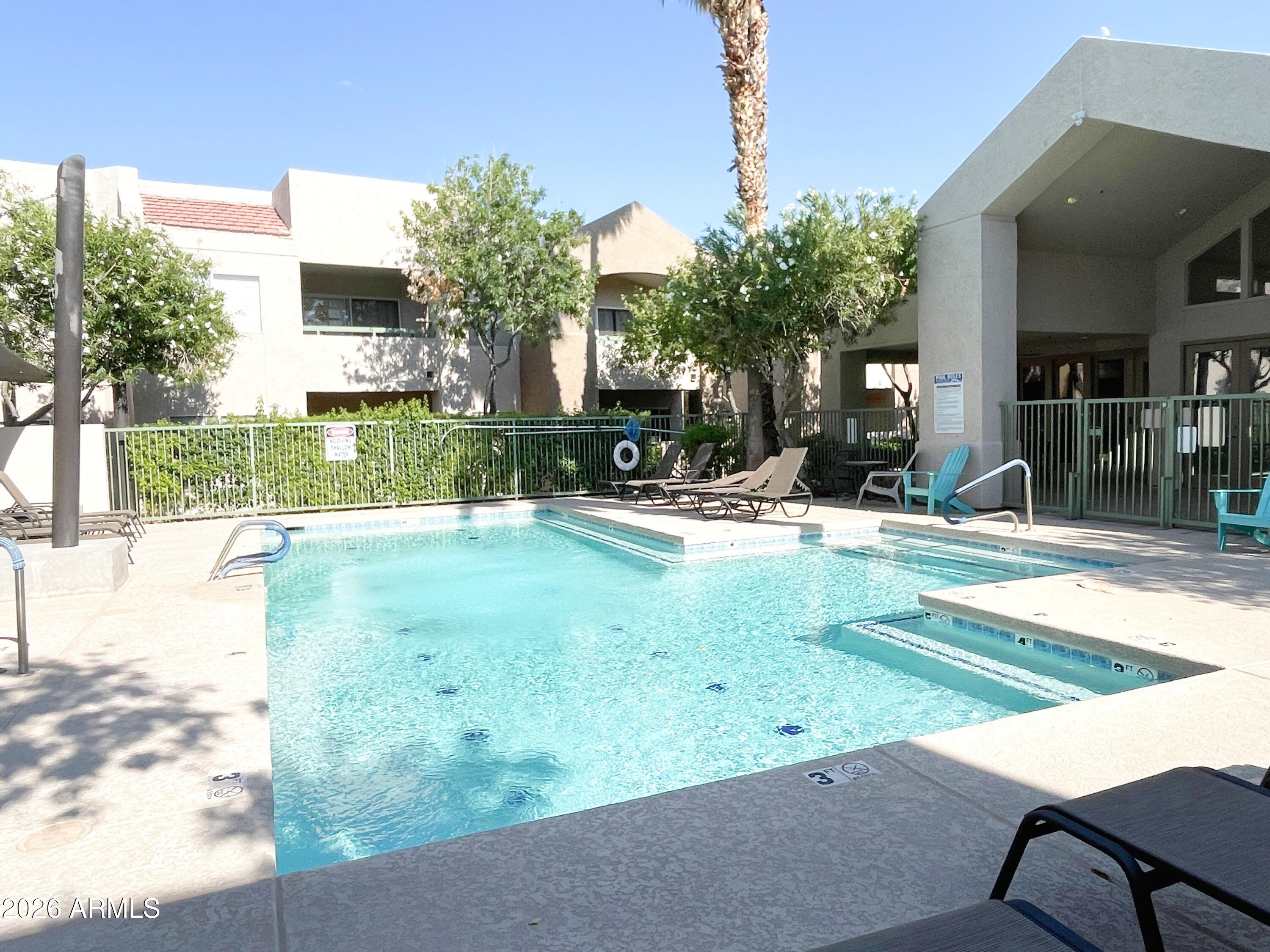 1295 North Ash Street, Unit 828 Gilbert, AZ 85233 - Photo 22 of 24 a view of a house with a park