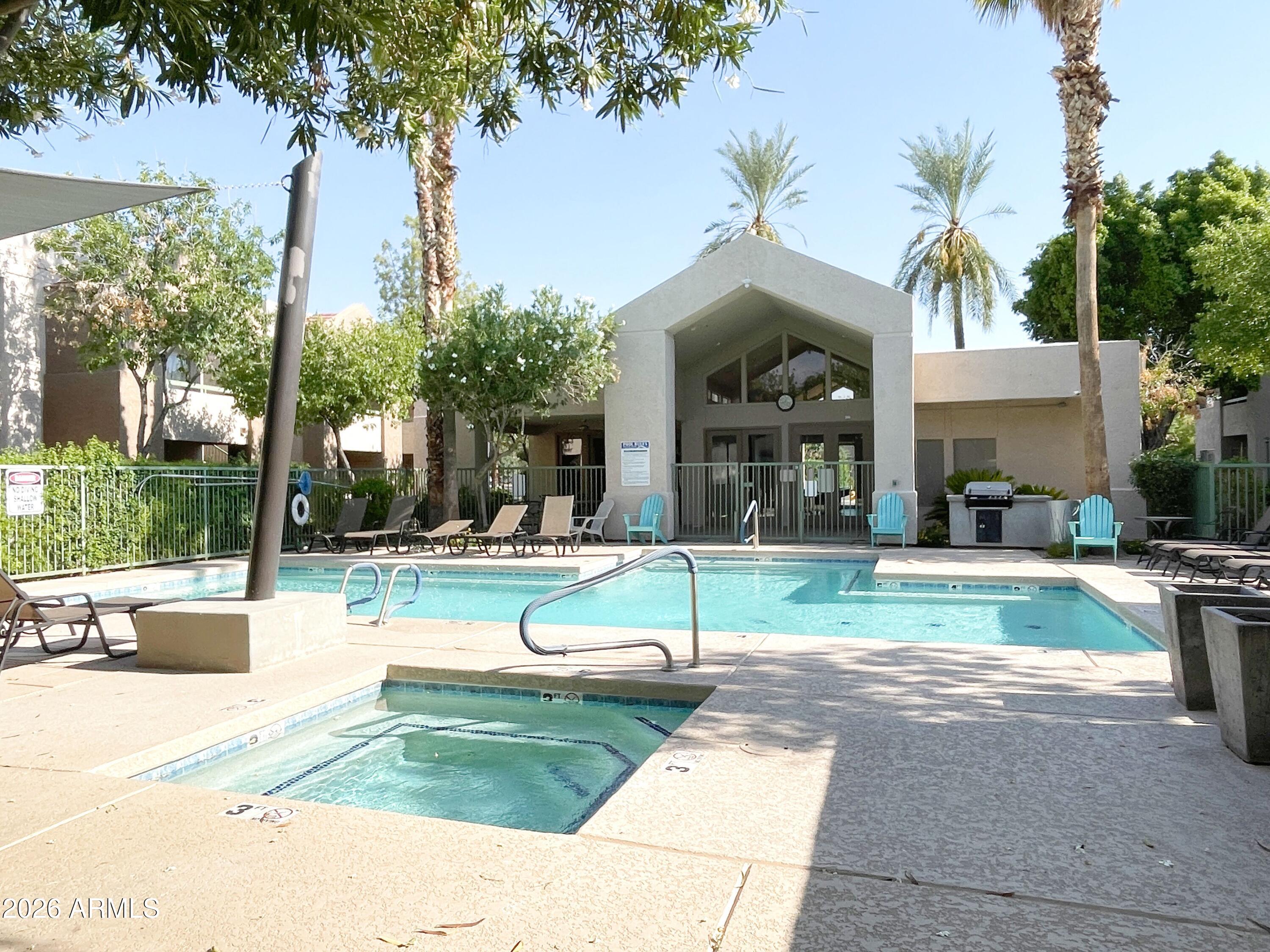 1295 North Ash Street, Unit 828 Gilbert, AZ 85233 - Photo 23 of 24 a view of a house with backyard and sitting area