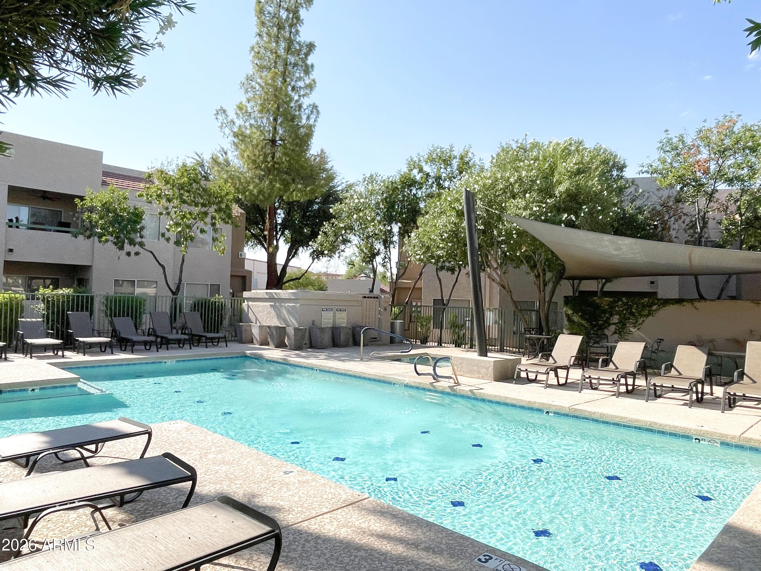 1295 North Ash Street, Unit 828 Gilbert, AZ 85233 - Photo 24 of 24 a view of a backyard with sitting area