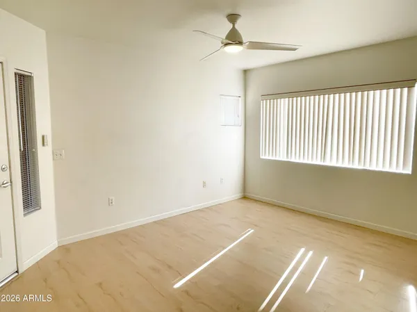 a view of an empty room with a window