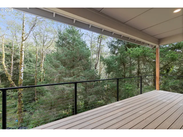 a view of balcony with wooden floor