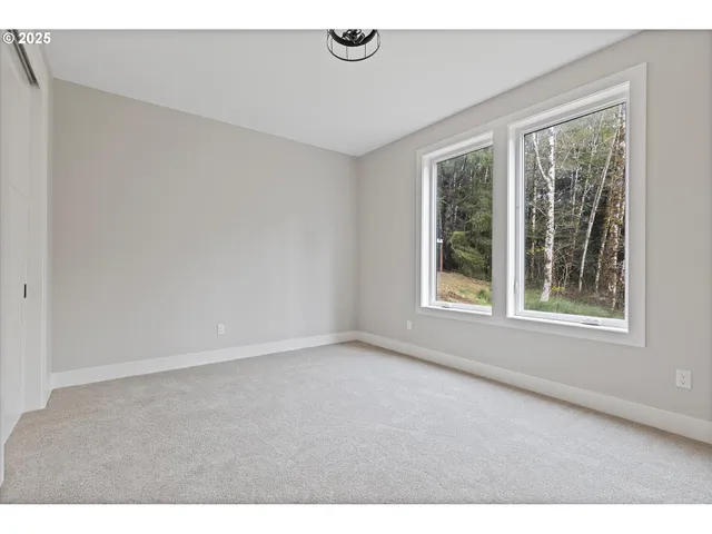 a view of an empty room and a window
