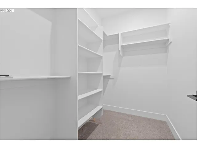 a view of an empty walk in closet