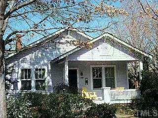 609 North Boundary Street Raleigh, NC 27604 - Photo 1 of 1 a view of small white house with large windows and a small yard
