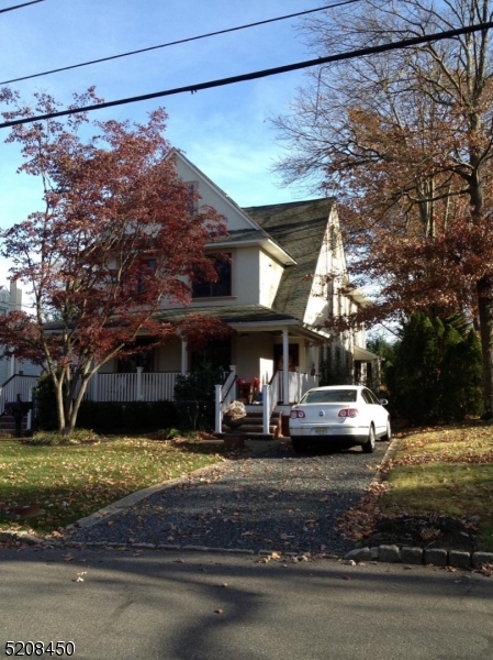 a view of a car parked on the side of the road